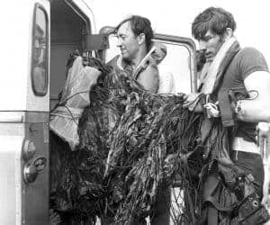 Stan Shout and John English after a water jump into the sea. circa 1972